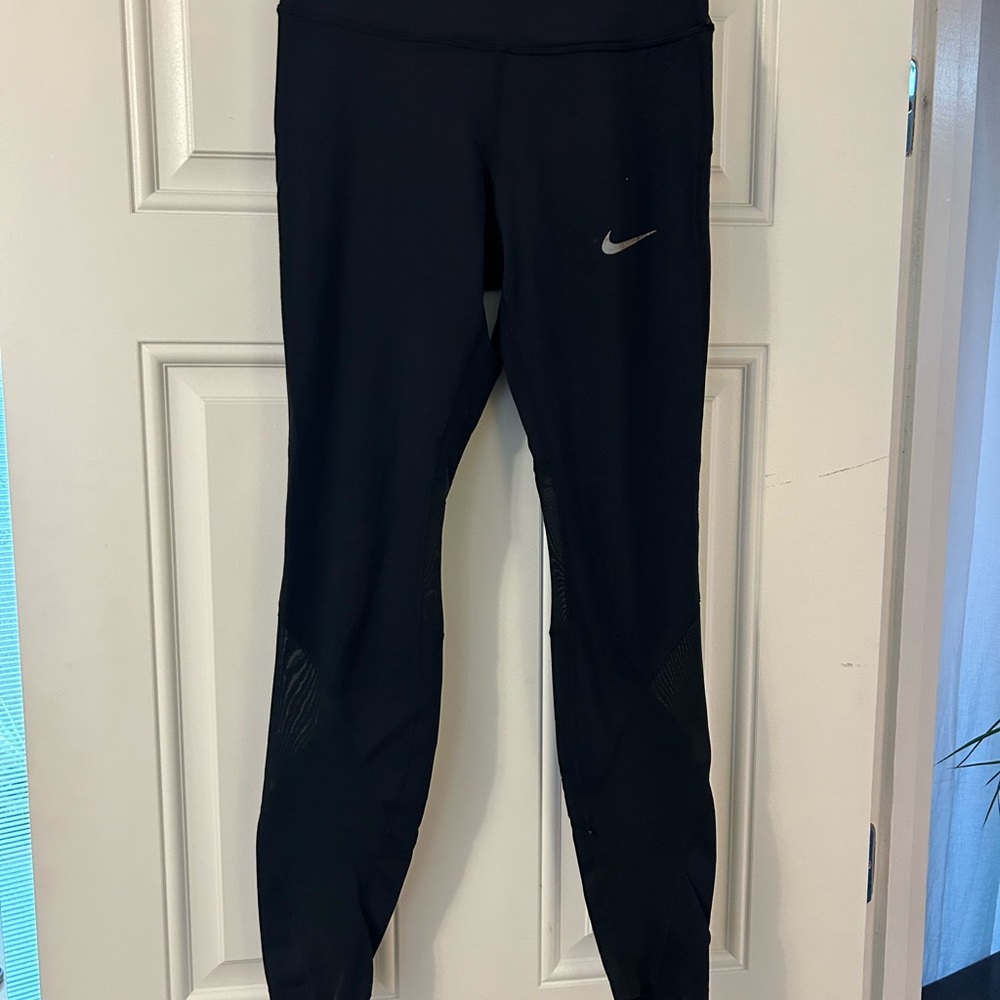 Black Nike dry fit running leggings.